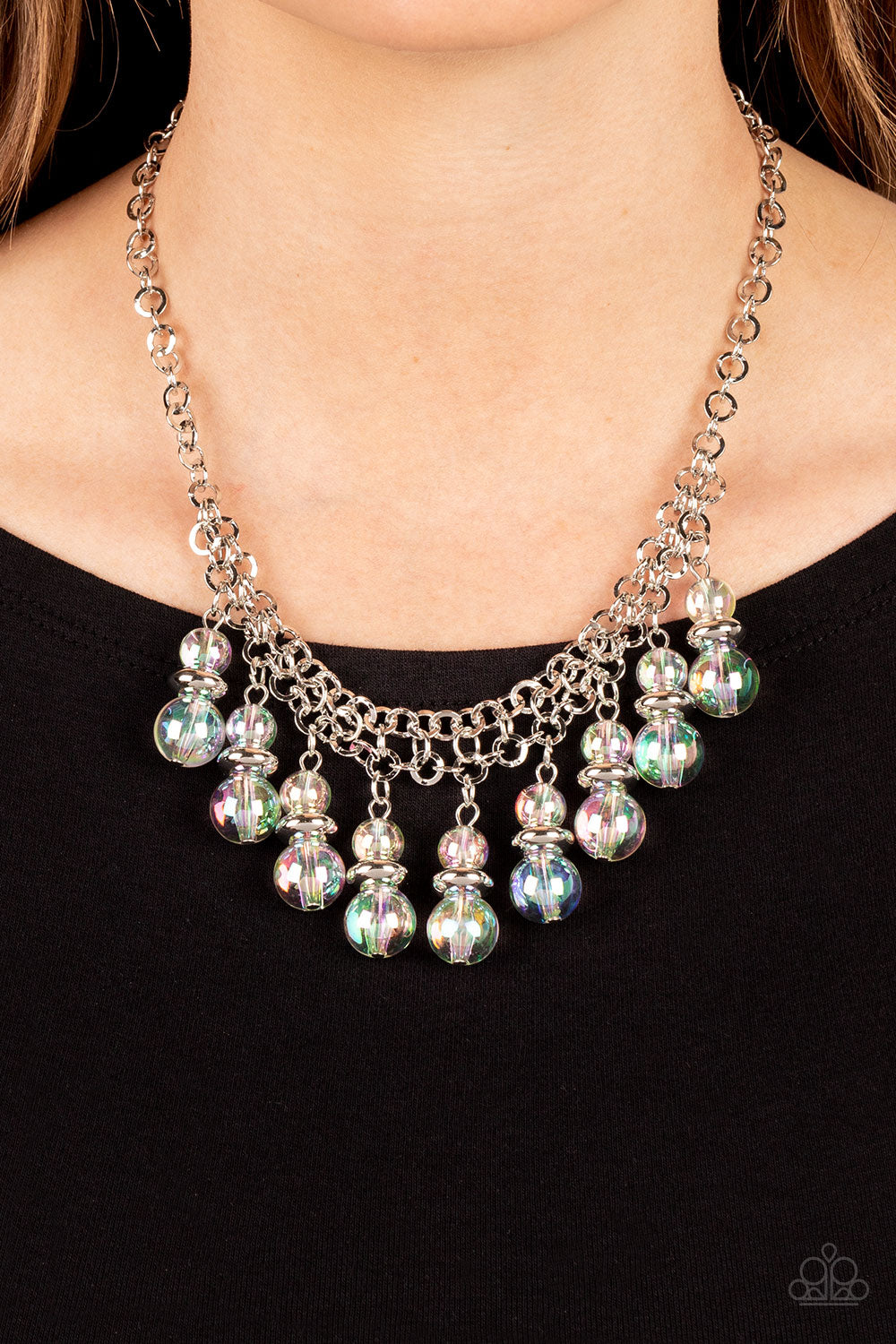 Paparazzi Accessories Deep Space Diva - Multi Featuring a stellar iridescence, pairs of glassy beads are separated by shiny silver discs, trickling below the collar in an effervescent fringe. Features an adjustable clasp closure. Due to its prismatic pale