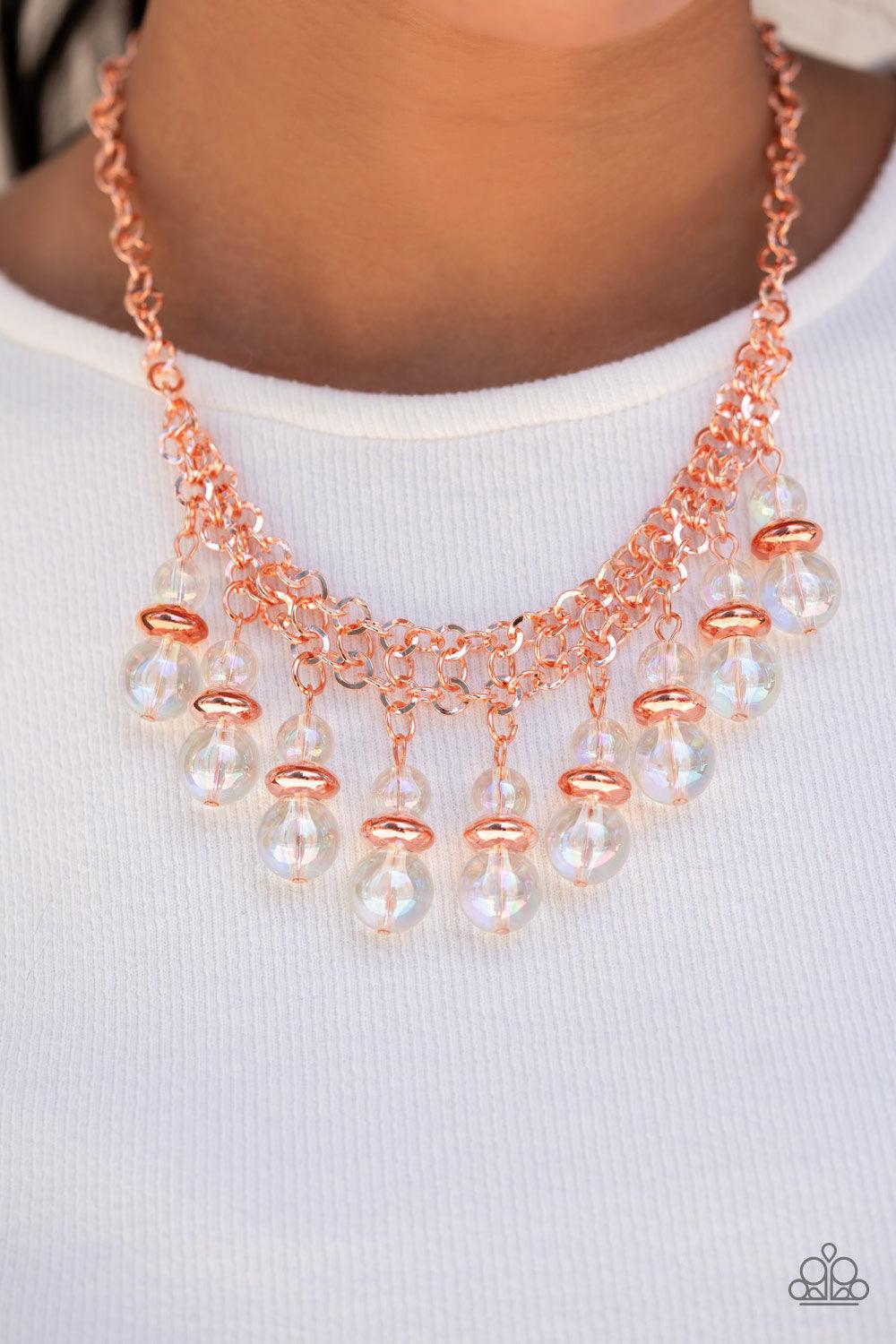 Paparazzi Accessories Deep Space Diva - Copper Featuring a stellar iridescence, pairs of glassy beads are separated by shiny copper discs, trickling below the collar in an effervescent fringe. Features an adjustable clasp closure. Due to its prismatic pal