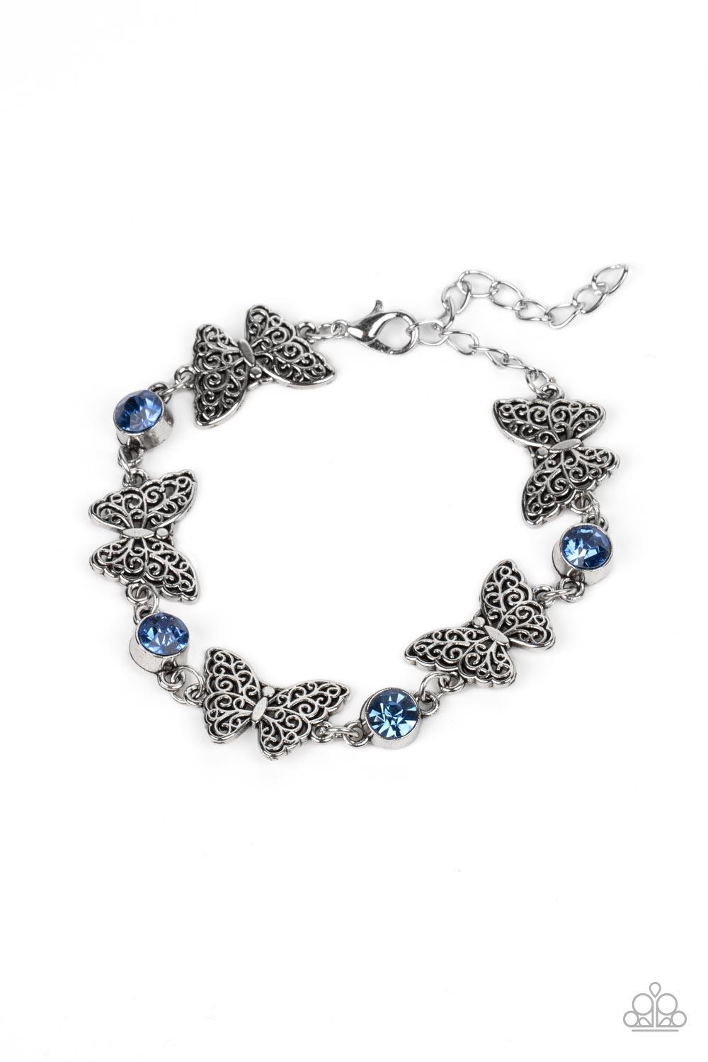 Paparazzi Accessories Has a WING to It - Blue Featuring filigree filled wings, dainty silver butterflies alternate with blue rhinestones around the wrist for a whimsical sparkle. Features an adjustable clasp closure. Sold as one individual bracelet. Jewel
