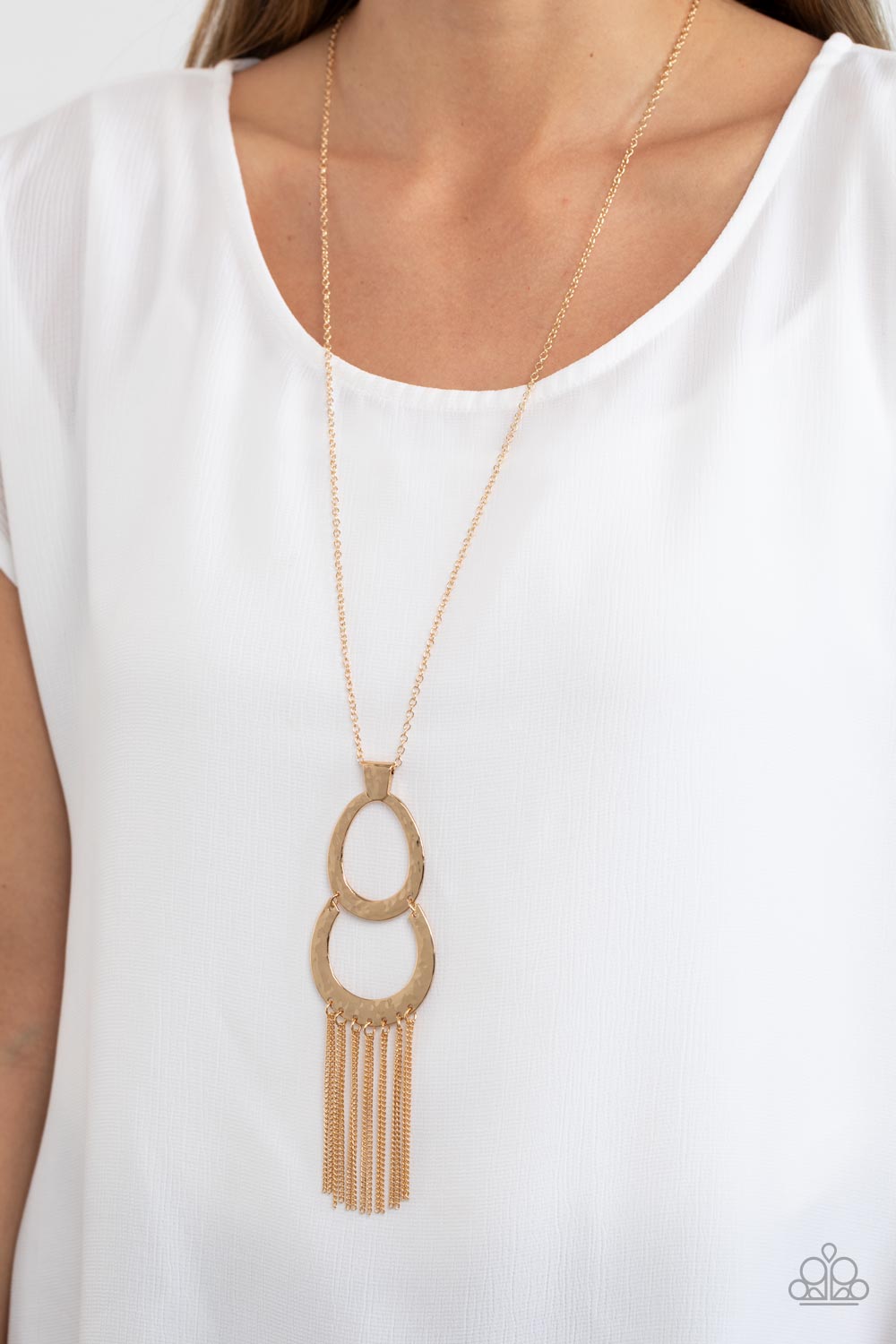 Paparazzi Accessories Reeling in Relics - Gold A hammered gold horseshoe links to the bottom of a hammered oval frame at the bottom of a lengthened gold chain. Glistening gold chains stream out from the bottom of the stacked pendant, adding eye-catching m