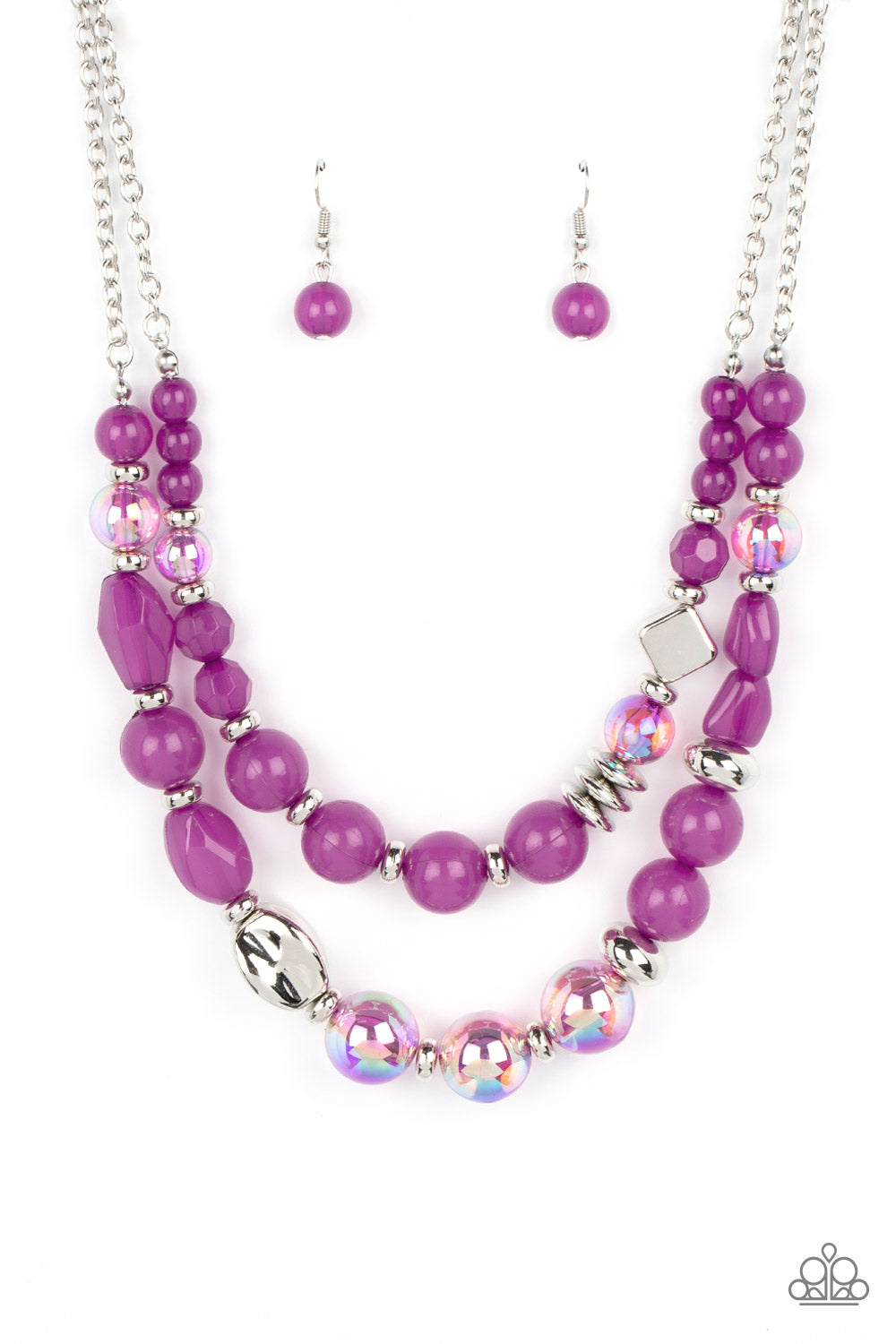 Paparazzi Accessories Mere Magic - Purple Featuring various shapes and finishes, a mismatched assortment of silver, iridescent, and opaque Dahlia beads have been threaded along invisible wires below the collar, creating ethereal layers. Features an adjust