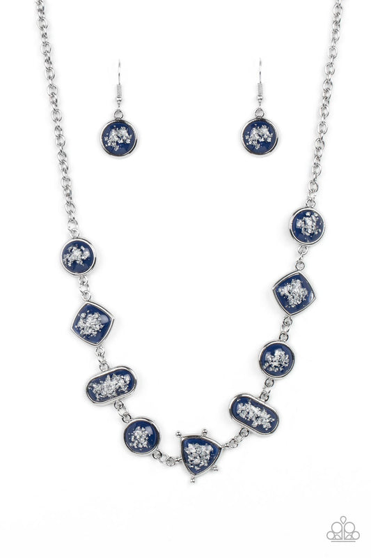 Paparazzi Accessories Fleek and Flecked - Blue Glassy blue beads speckled in flecks of silver shimmer delicately hang from a silver chain, linking into a glitzy geometric pattern along the collar. Features an adjustable clasp closure. Sold as one individu