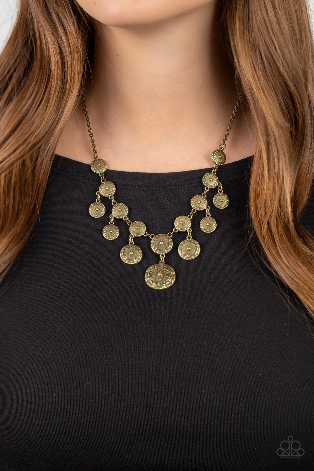 Paparazzi Accessories Sahara Stars - Brass Dainty brass studs radiate out into a star pattern around a starry stud, creating elaborate brass frames. Varying in size, the coin-like frames trickle along the collar, creating a rustic fringe. Features an adju