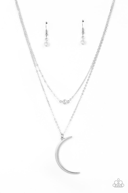 Paparazzi Accessories Modern Moonbeam - White Two dainty silver chains delicately layer below the collar. A white crystal-like bead sparkles at the center of the uppermost chain while a silver half moon pendant swings from the bottom of the display for a