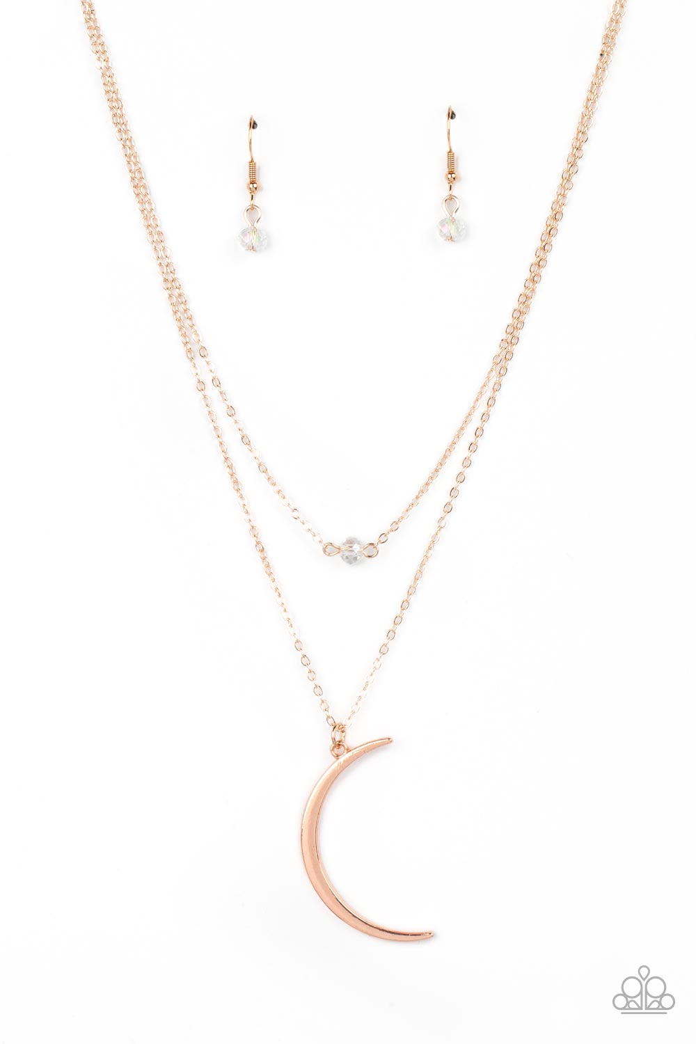 Paparazzi Accessories Modern Moonbeam - Rose Gold Two dainty rose gold chains delicately layer below the collar. A white crystal-like bead sparkles at the center of the uppermost chain while a rose gold half moon pendant swings from the bottom of the disp