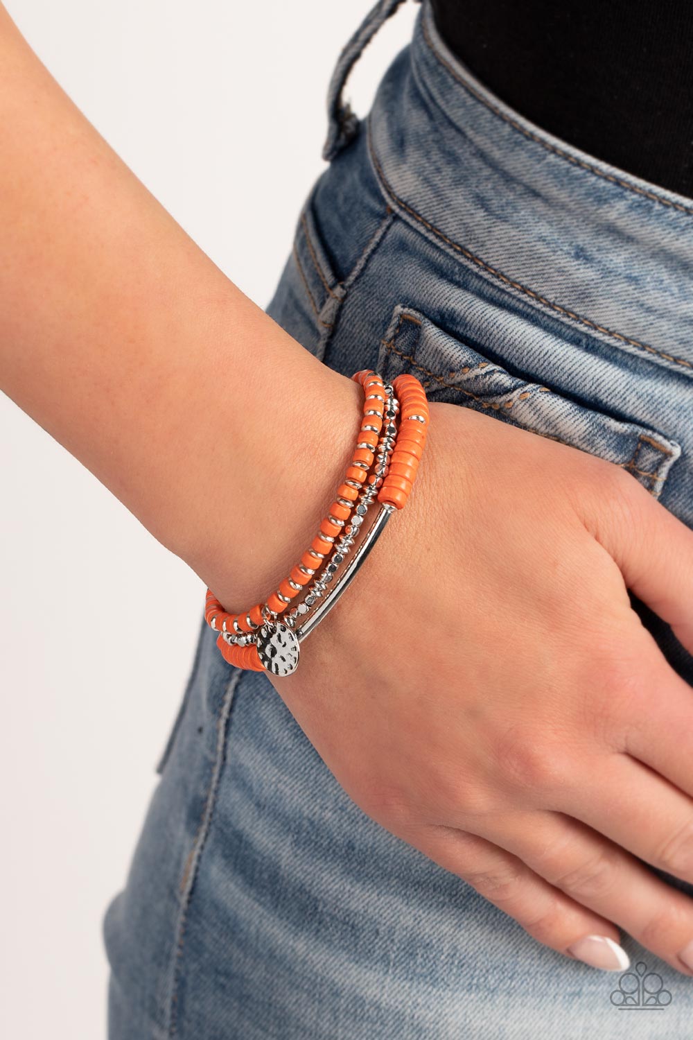 Paparazzi Accessories Terraform Trendsetter - Orange A collection of shiny silver square and oval beads, refreshing orange stone discs, a hammered silver disc, and a curved silver cylinder, are threaded along stretchy bands, making three distinctive desig