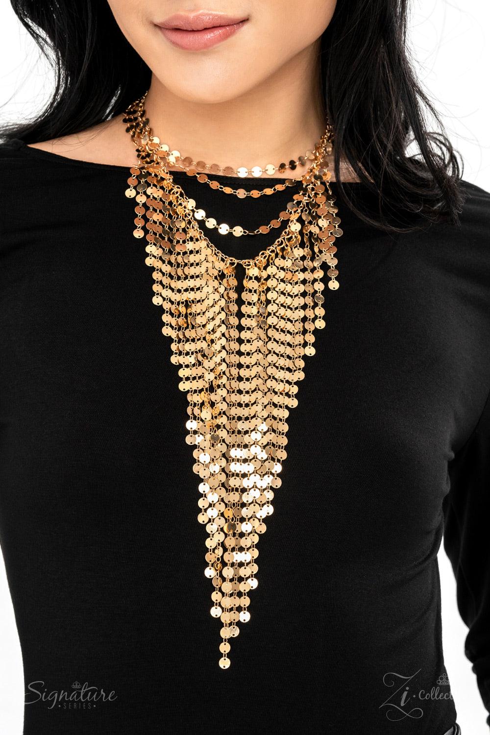 Paparazzi Accessories The Suz A seemingly infinite collection of dainty gold discs flickers and flashes as they catch the light, draping into four shimmery rows down the chest. Twinkly tassels of matching gold discs stream out from the bottom of the lower