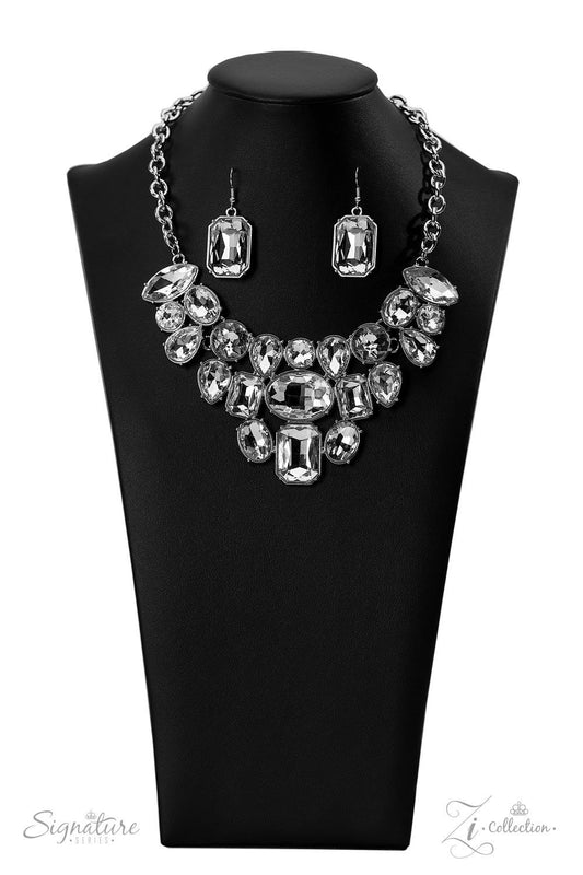 Paparazzi Accessories The Tasha Encased in pronged silver frames, a collection of oversized marquise, round, oval, emerald, and teardrop shaped white gems blindingly coalesces into a jaw-dropping statement piece below the collar. At the center of the coll