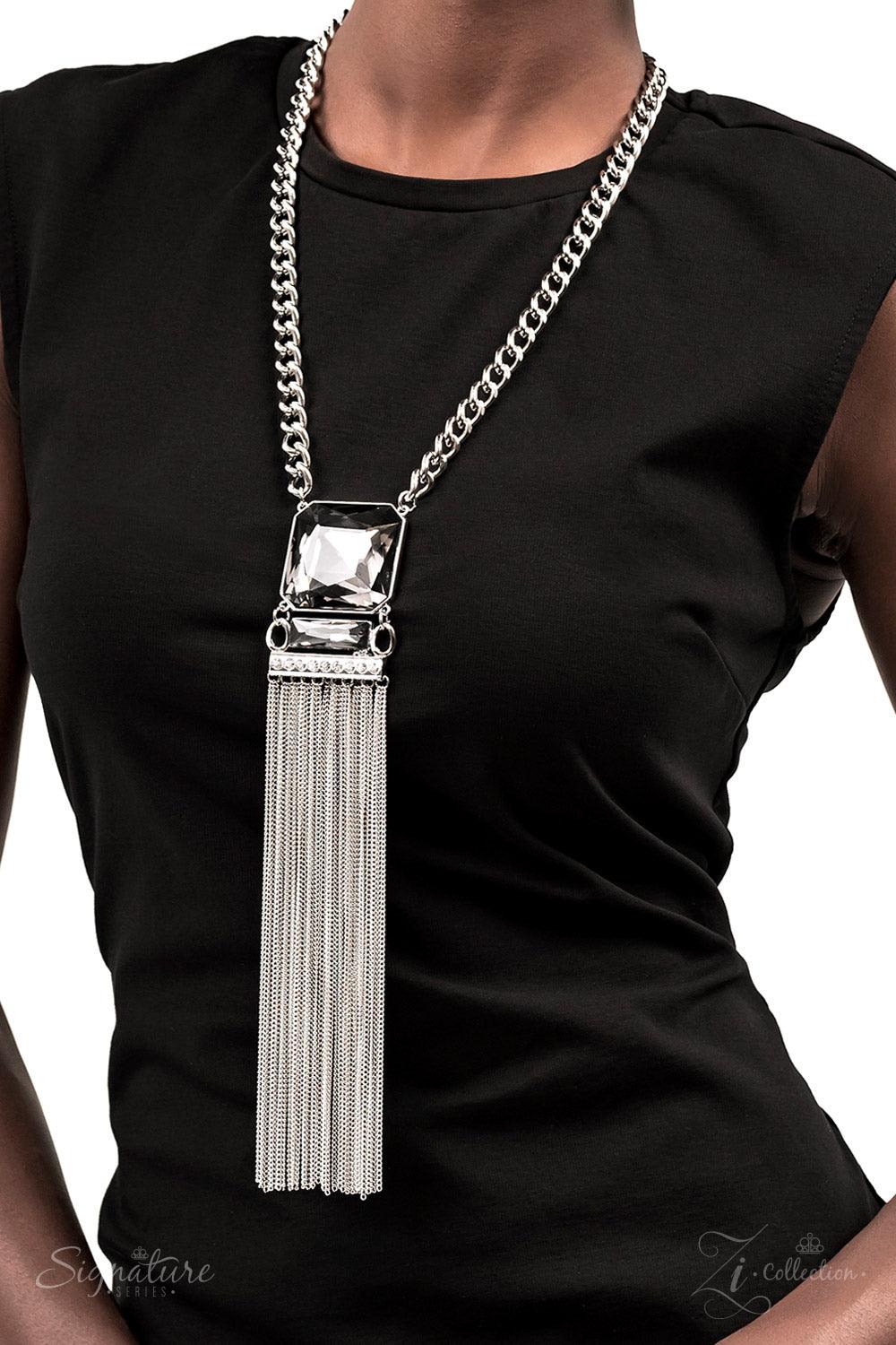 Paparazzi Accessories The Hope A dramatically oversized, smoky, Asscher cut gem sits boldly at the bottom of a thick silver chain, creating a majestic focal point. An emerald cut gem in the same smoky hue connects to the bottom of the large centerpiece, f