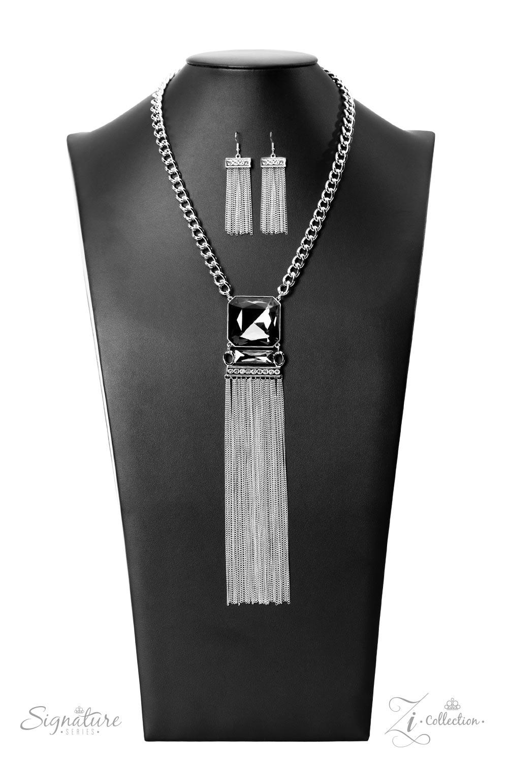 Paparazzi Accessories The Hope A dramatically oversized, smoky, Asscher cut gem sits boldly at the bottom of a thick silver chain, creating a majestic focal point. An emerald cut gem in the same smoky hue connects to the bottom of the large centerpiece, f