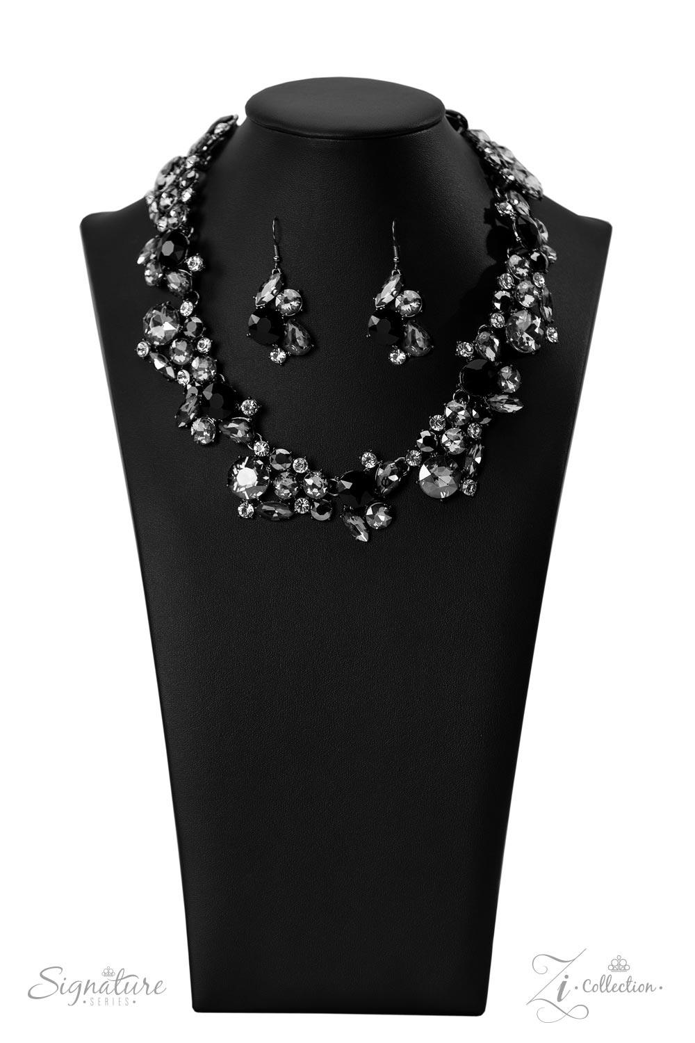 Paparazzi Accessories The Kim A smoldering explosion of smoky gray, jet black, and sparkling white rhinestones gather into haphazard clusters that link fearlessly along the collar. The faceted edges of each round, marquise, and teardrop cut gem scatter li