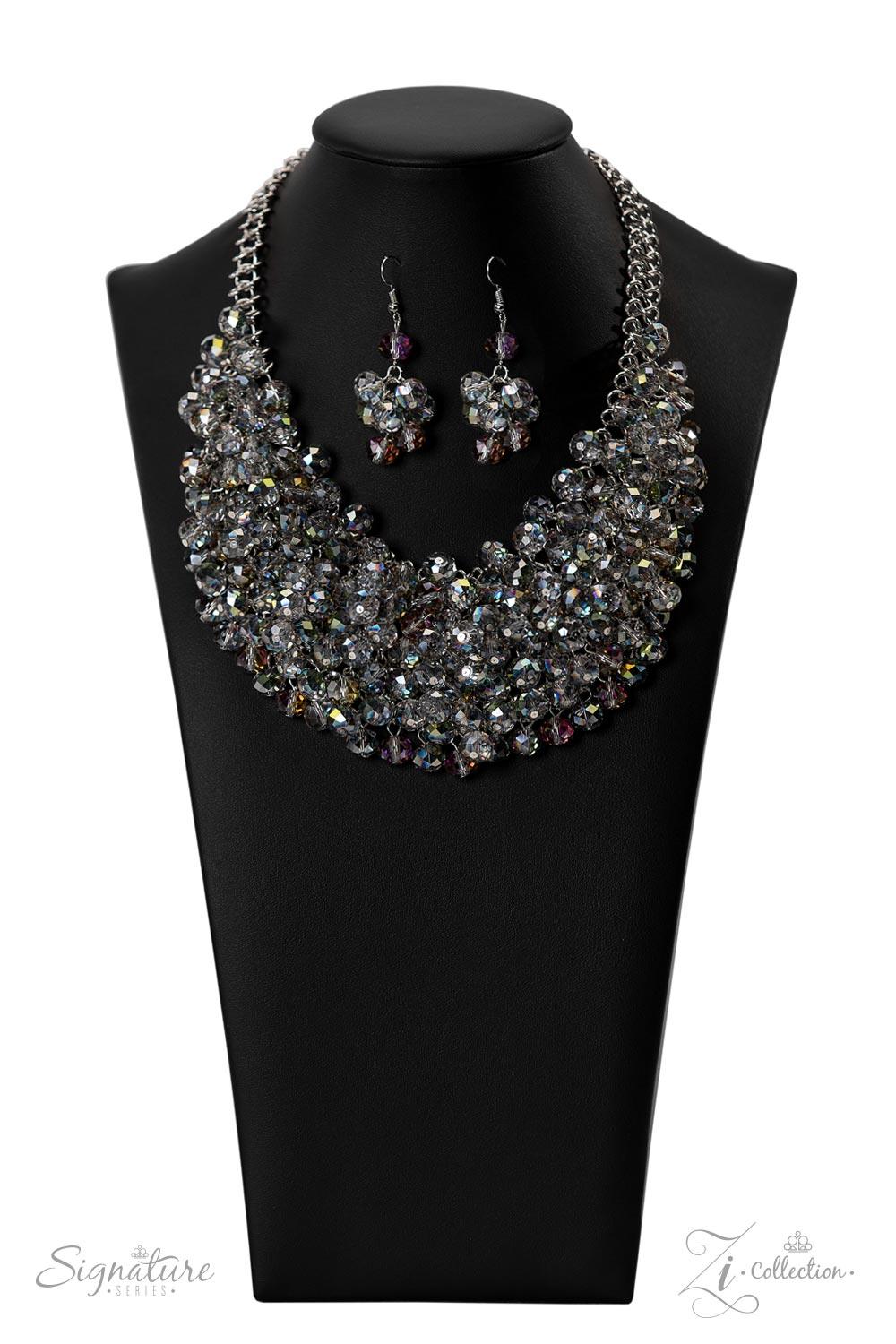 Paparazzi Accessories The Tanger Countless clear, crystal-like beads connect to a netted backdrop of interlocking silver links, building into a boisterous display of glassy elegance. Each faceted edge of the beads is brushed in a dreamily iridescent or hy