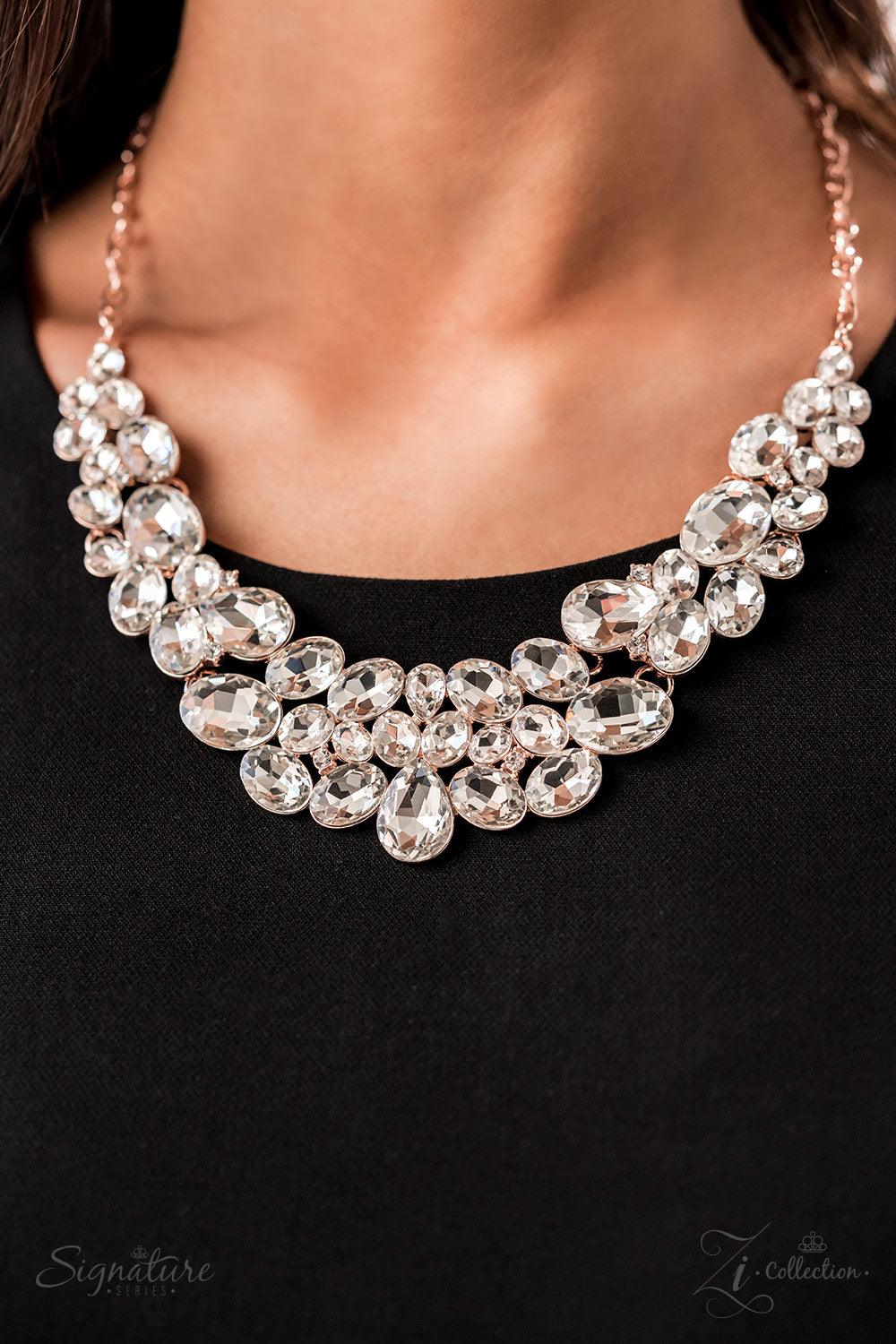 Paparazzi Accessories The Jenni Oversized white rhinestones with exaggerated faceted surfaces gather into glittery clusters along the collar. A teardrop-shaped gem sits front-and-center, inviting the eye to explore the scattered shapes throughout the desi