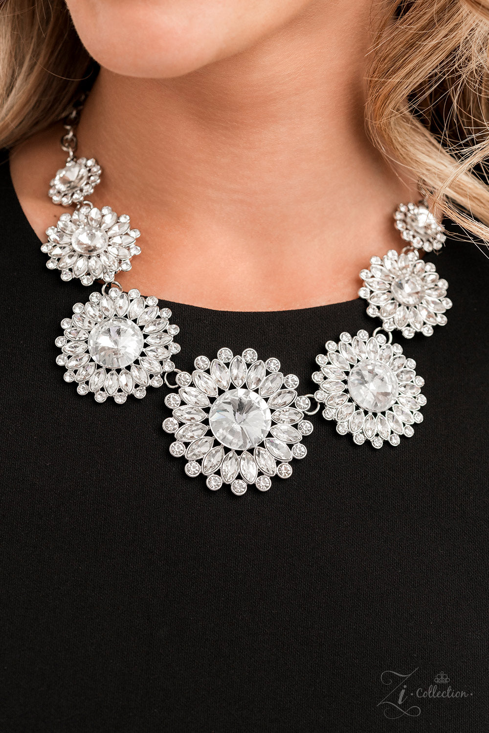 Paparazzi Accessories Optimistic Oversized classic white rhinestones are encircled by majestic marquise-cut rhinestones in the same radiant finish, creating a collection of stunning floral frames. Smaller white rhinestones fall in between each gorgeous ma