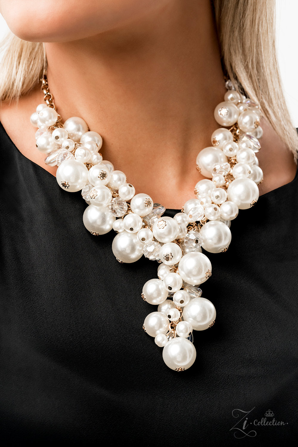 Paparazzi Accessories Flawless Imperfect glass-like beads and faceted clear beads are brushed in a hint of iridescence, allowing them to shimmer amongst an effervescent collection of classic and oversized white pearls. Dramatically clustered along a shiny