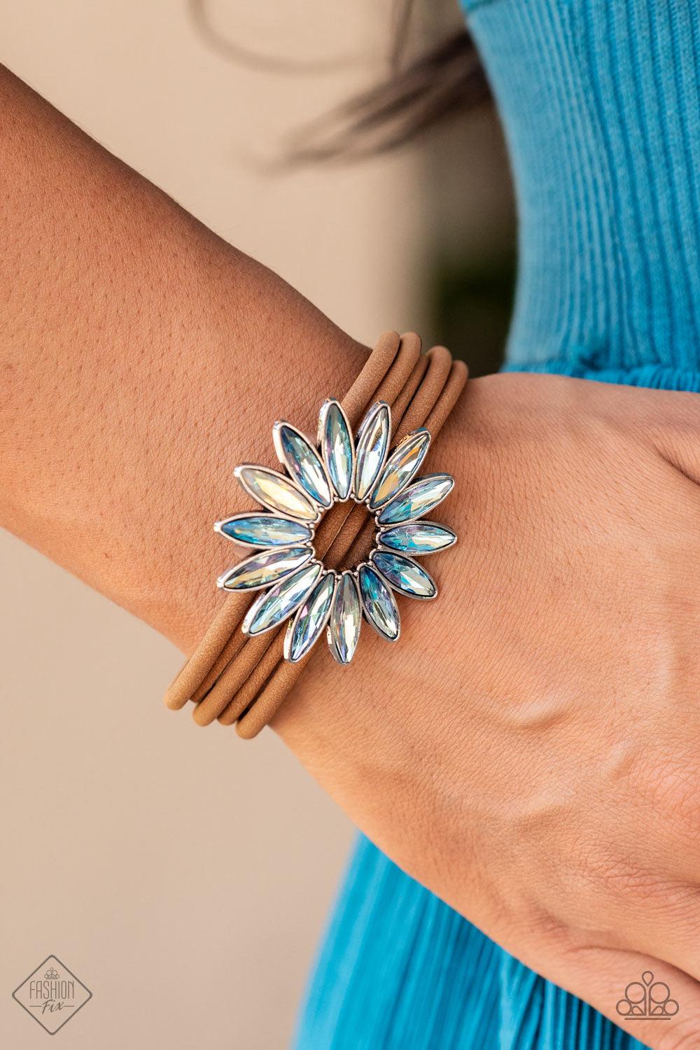 Paparazzi Accessories Astral Adventure - Multi Row after row of brown suede cords layer around the wrist. Featuring oblong marquise style cuts, an iridescent collection of rhinestones fans out into a circular focal point, resulting in a celestial centerpi