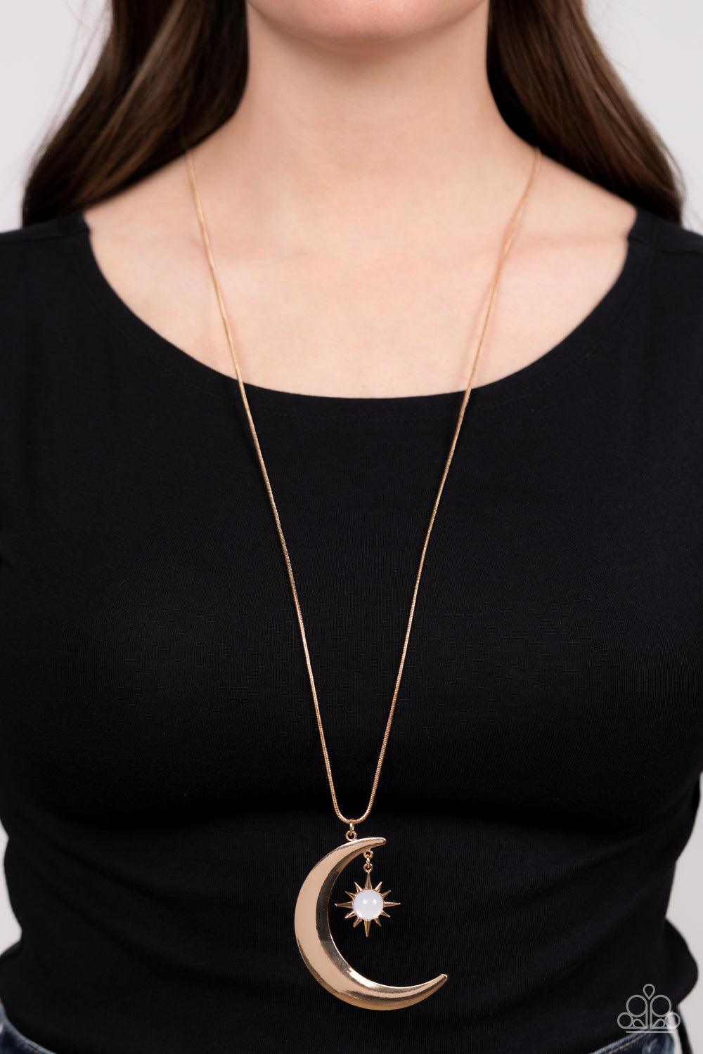 Paparazzi Accessories Astral Ascension - Gold An opaque white bead is pressed into the center of a gold star that dances from the top of a gold half moon pendant, creating a celestial pendant at the bottom of a lengthened gold snake chain. Features an adj