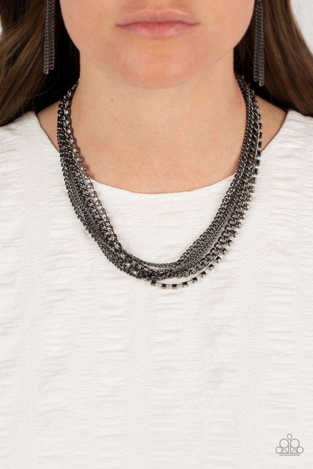 Paparazzi Accessories Free to CHAINge My Mind - Black A mashup of gunmetal chains collides with a strand of sparkling white rhinestones encased in gunmetal fittings. The contrast of gritty gunmetal finishes and shimmery accents creates a brilliant display