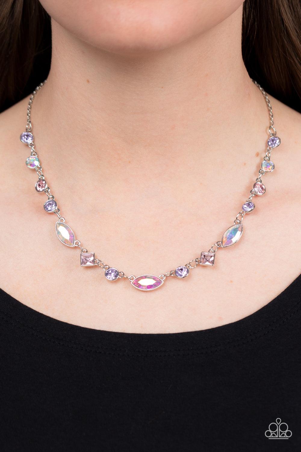 Paparazzi Accessories Irresistible HEIR-idescence - Multi Varying in geometric shapes and shades, glittery purple and pink gems are sprinkled between iridescent rhinestone accents for a dreamy refined, and irresistible finish. Features an adjustable clasp