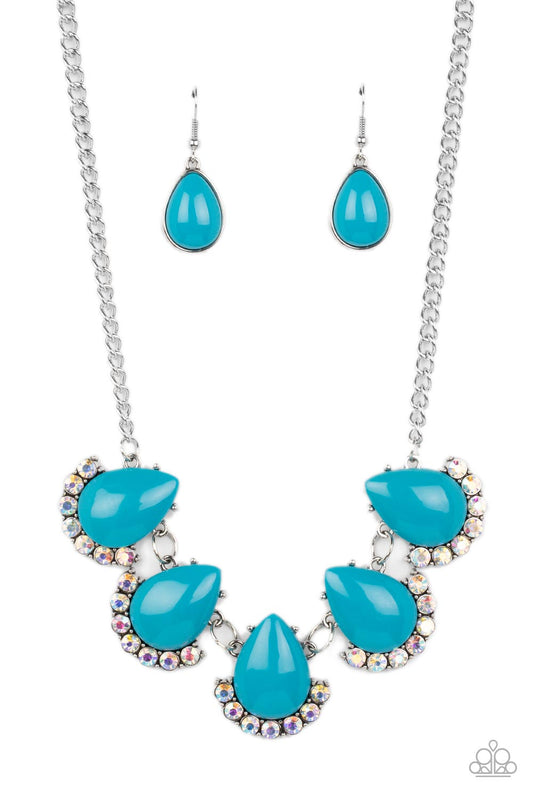 Paparazzi Accessories Ethereal Exaggerations - Blue Underscored by rows of iridescent rhinestones, a row of oversized blue teardrop beads dramatically links into a powerful pop of color below the collar. Features an adjustable clasp closure. Due to its pr