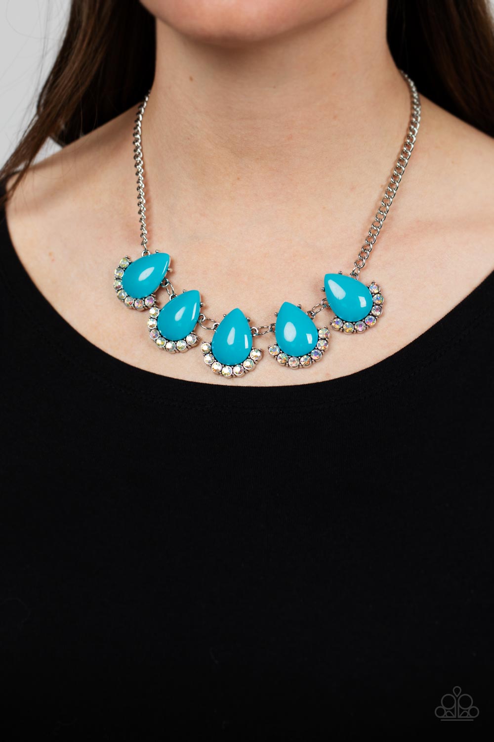 Paparazzi Accessories Ethereal Exaggerations - Blue Underscored by rows of iridescent rhinestones, a row of oversized blue teardrop beads dramatically links into a powerful pop of color below the collar. Features an adjustable clasp closure. Due to its pr