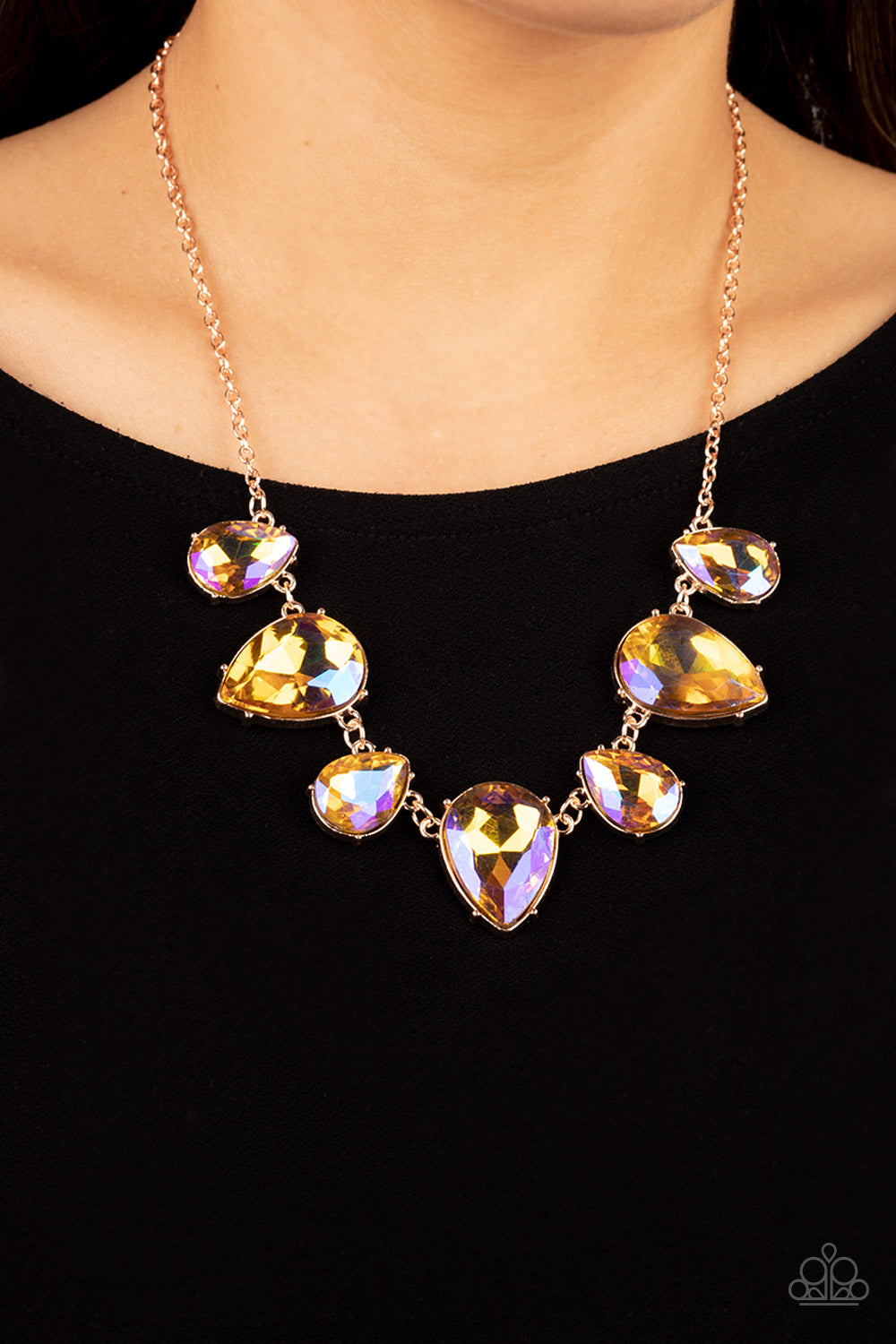 Paparazzi Accessories Otherworldly Opulence - Multi 2 Featuring a stellar iridescence, an oversized collection of glittery iridescent teardrop gems alternates upside down and right-side-up below the collar for an out-of-this-world sparkle. Features an adj