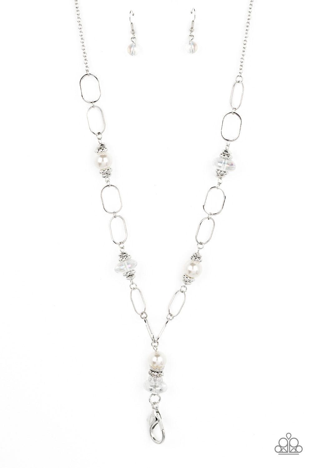 Paparazzi Accessories Creative Couture - White *Lanyard Infused with faceted and studded silver accents, iridescent beads and oversized white pearls connect with sections of oversized silver hoops across the chest for a refined flair. A lobster clasp hang