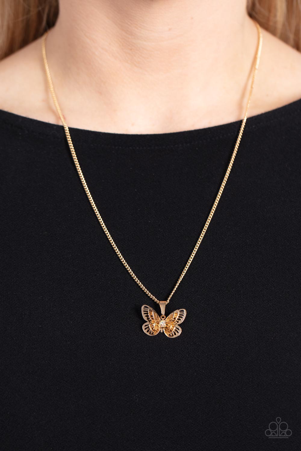 Paparazzi Accessories High-Flying Fashion - Multi A whimsical 3-D butterfly in a high sheen golden finish elegantly slides along a gold chain. An iridescent rhinestone is nestled at the center of the butterfly's wings, adding a hint of sparkle to the desi