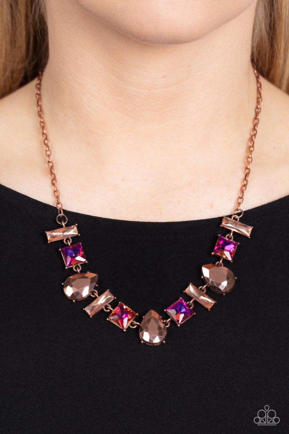 Paparazzi Accessories Interstellar Ice - Copper Featuring glassy, iridescent, and oil spill finishes, a mismatched collection of emerald cut topaz, square multicolored, and teardrop metallic copper gems delicately connect below the collar for a stellar st