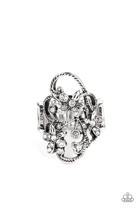 Paparazzi Accessories Flirtatiously Flowering - White Sparkly white rhinestones are sprinkled across swirls of textured silver filigree and flowers, creating a glittery garden scene atop the finger. Features a stretchy band for a flexible fit. Sold as one