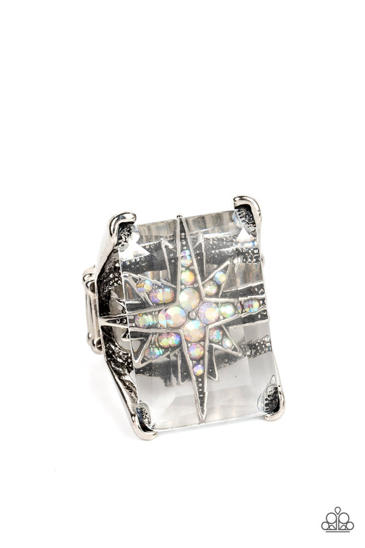 Paparazzi Accessories Starry Serenity - Multi A white iridescent rhinestone-dotted star twinkles behind a glassy pane that seemingly floats atop the pronged frame, resulting in a stellar statement piece. Due to its prismatic palette, color may vary. Featu