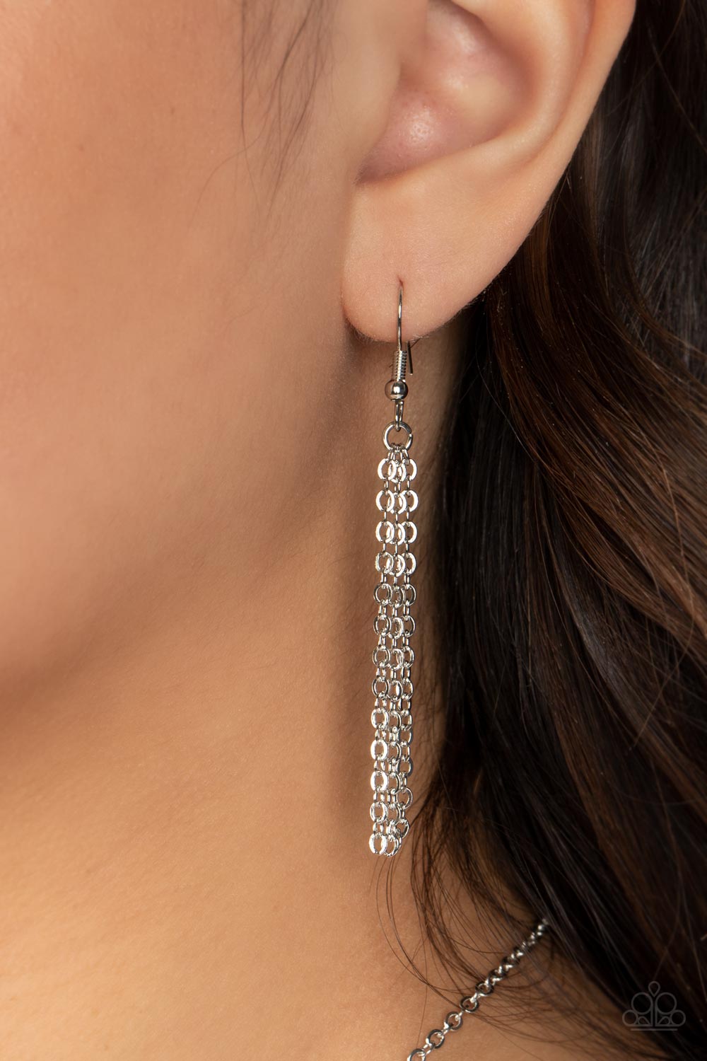 Paparazzi Accessories Opalescent Oblivion - Blue Featuring a refracted shimmer and an opalescent finish, a collection of emerald-cut, glassy blue gems link along the collar to create a hypnotic pop of color. Each gem is pressed into a silver frame with pr