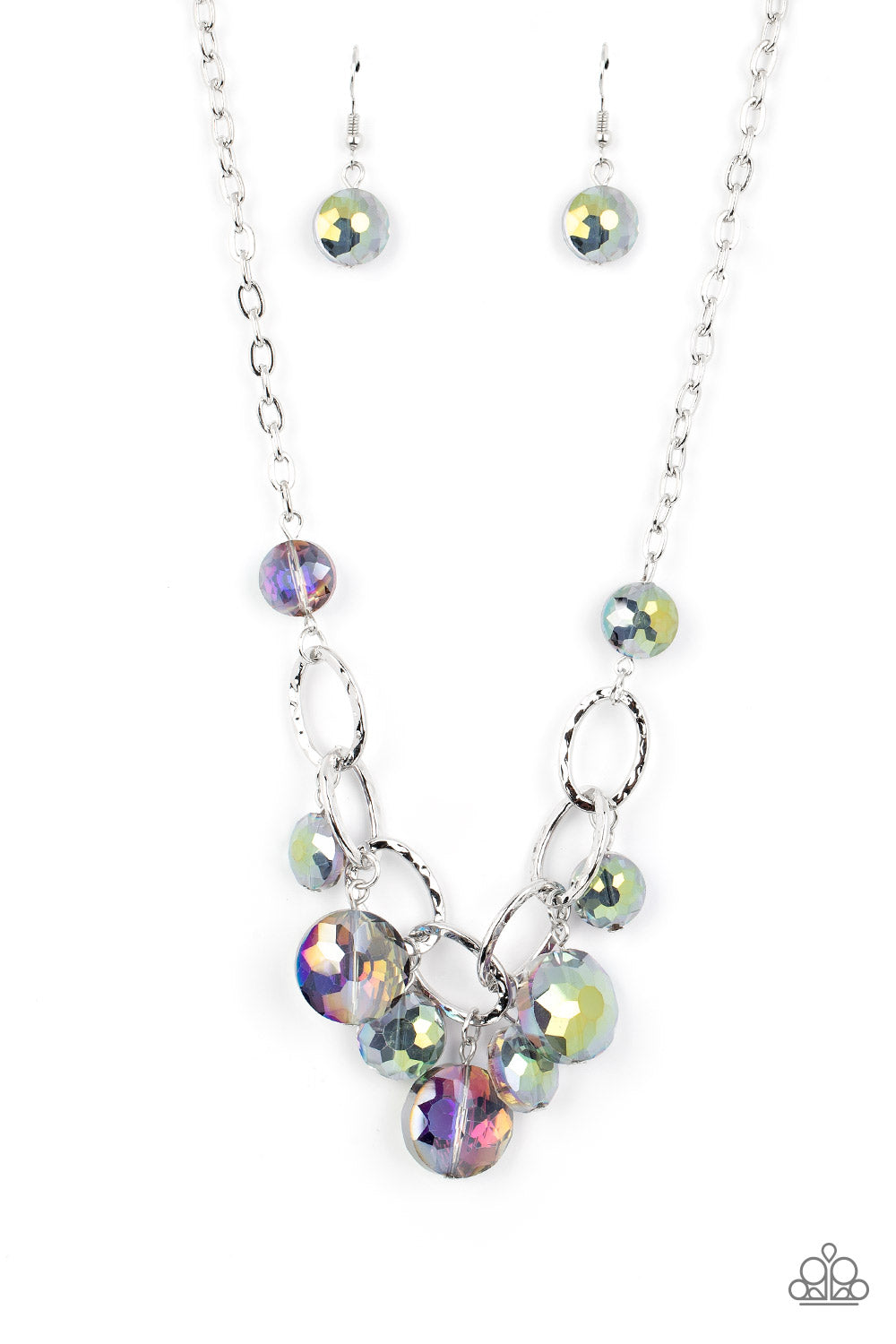 Paparazzi Accessories Rhinestone River - Multi A collection of round, glassy purple-shaded beads in varying sizes swirl around shiny silver oval links hammered in texture. The beveled shape and faceted surfaces of the beads are brushed in a subtle oil-spi