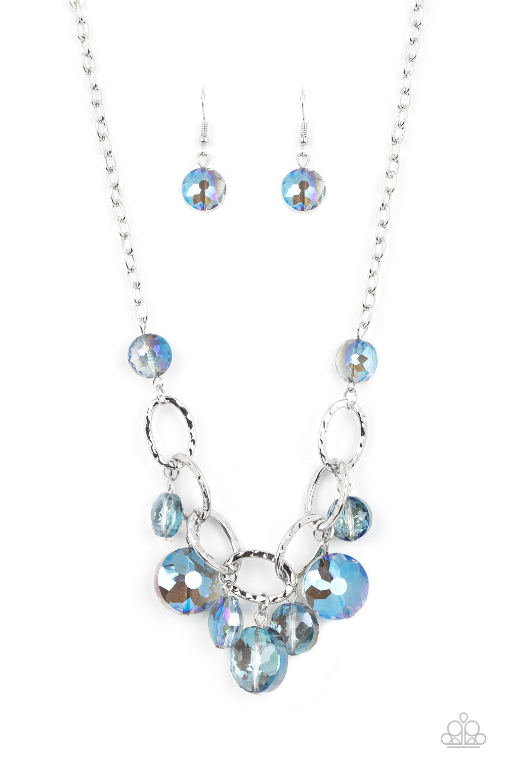 Paparazzi Accessories Rhinestone River - Blue A collection of round, glassy blue beads in varying sizes swirl around shiny silver oval links hammered in texture. The beveled shape and faceted surfaces of the beads are brushed in a subtle reflective glaze,