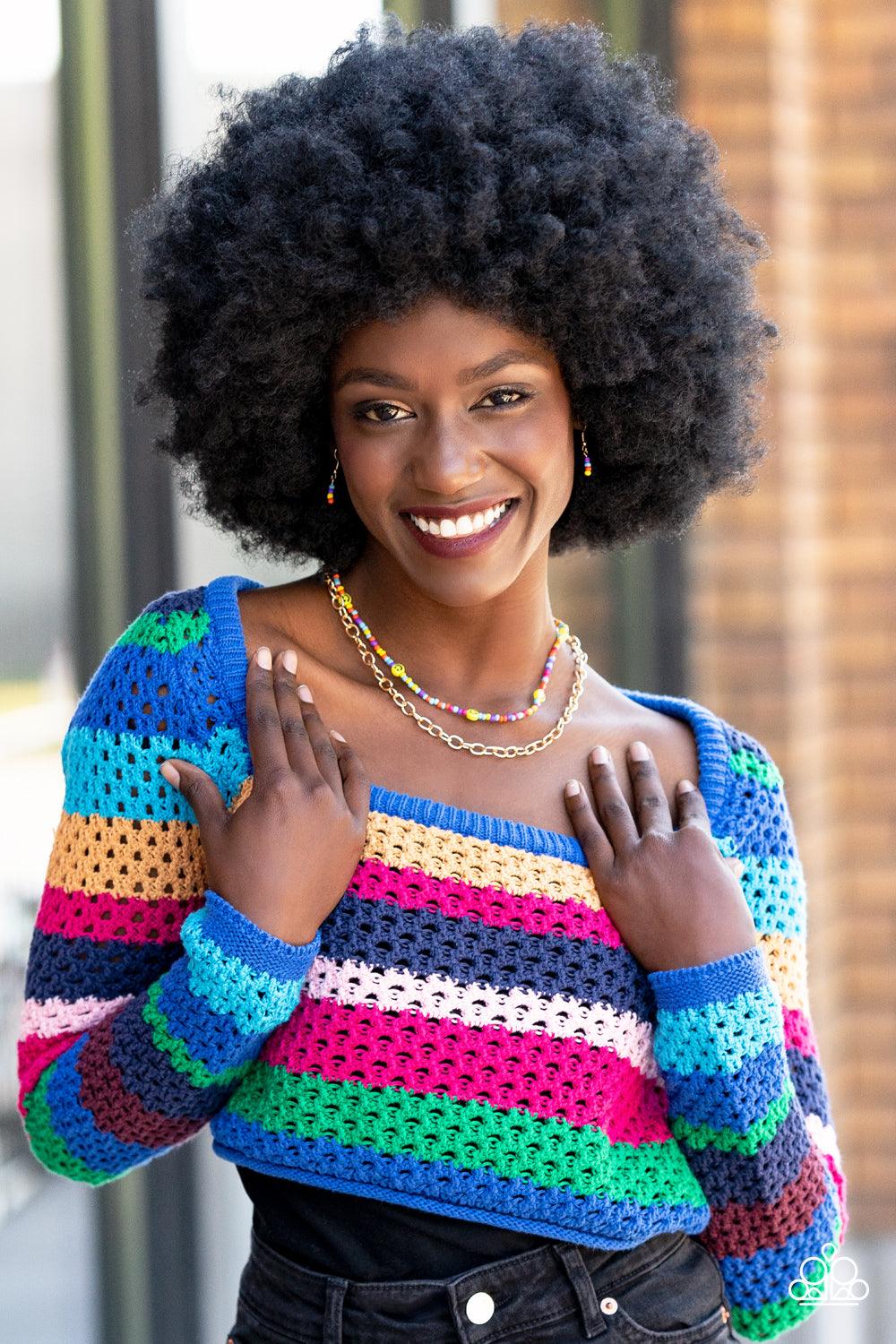 Paparazzi Accessories Happy Looks Good on You - Multi Layered together with a bold gold chain, dainty multicolored seed beads and yellow smiley face beads are threaded along an invisible wire below the collar, resulting in a colorfully retro design. Featu