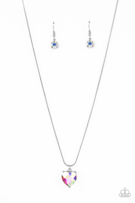 Paparazzi Accessories Smitten with Style - Multi A heart-shaped rhinestone brushed in a reflective iridescent finish sparkles brilliantly as it slides along a skinny silver snake chain. The gem is pressed into a thick silver frame, allowing its faceted su