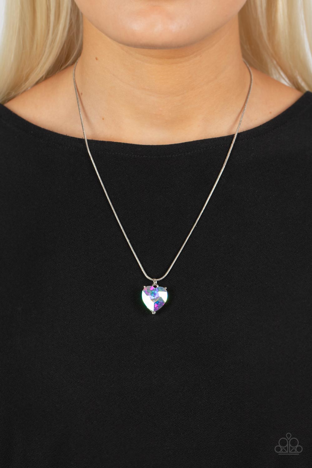 Paparazzi Accessories Smitten with Style - Multi A heart-shaped rhinestone brushed in a reflective iridescent finish sparkles brilliantly as it slides along a skinny silver snake chain. The gem is pressed into a thick silver frame, allowing its faceted su