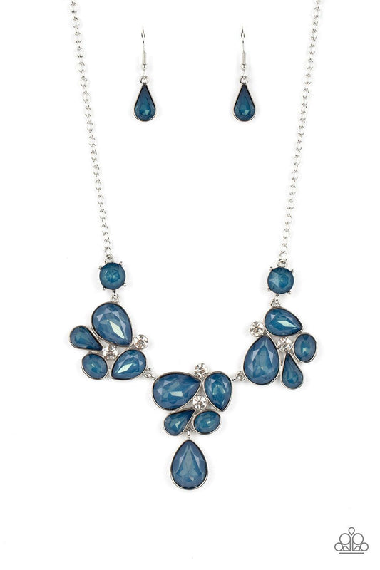 Paparazzi Accessories Everglade Escape - Blue Draped elegantly across the chest, clusters of geometric blue gems, brushed in the fall Pantone® of Midnight, gather around sparkling white rhinestones, creating a bright and beautiful pattern. Features an adj