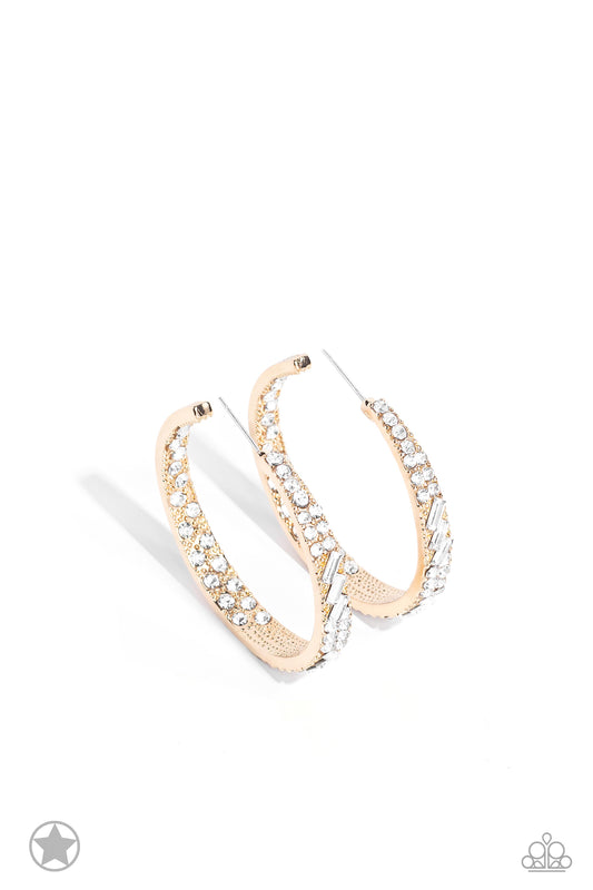 Paparazzi Accessories GLITZY By Association - Gold The front-facing surface of a chunky gold hoop is dipped in brilliantly sparkling white rhinestones while light-catching texture wraps around the back. The interior of the hoop features the opposite patte