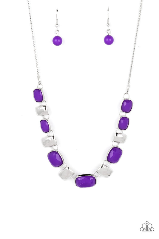 Paparazzi Accessories Polished Parade - Purple Rounded rectangular beads in a vibrant purple hue are pressed into silver frames, showcasing their faceted surfaces as they crawl along the collar. Small rectangular plates, hammered in subtle texture, shimme