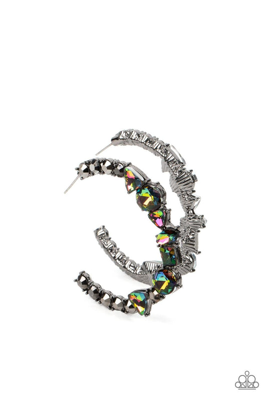 Paparazzi Accessories New Age Nostalgia - Multi Flanked by hematite rhinestones, a collection of geometric rhinestones with an oil-spill finish sleekly curve around the ear, creating a trendy, yet nostalgic display. Due to its prismatic palette, color may