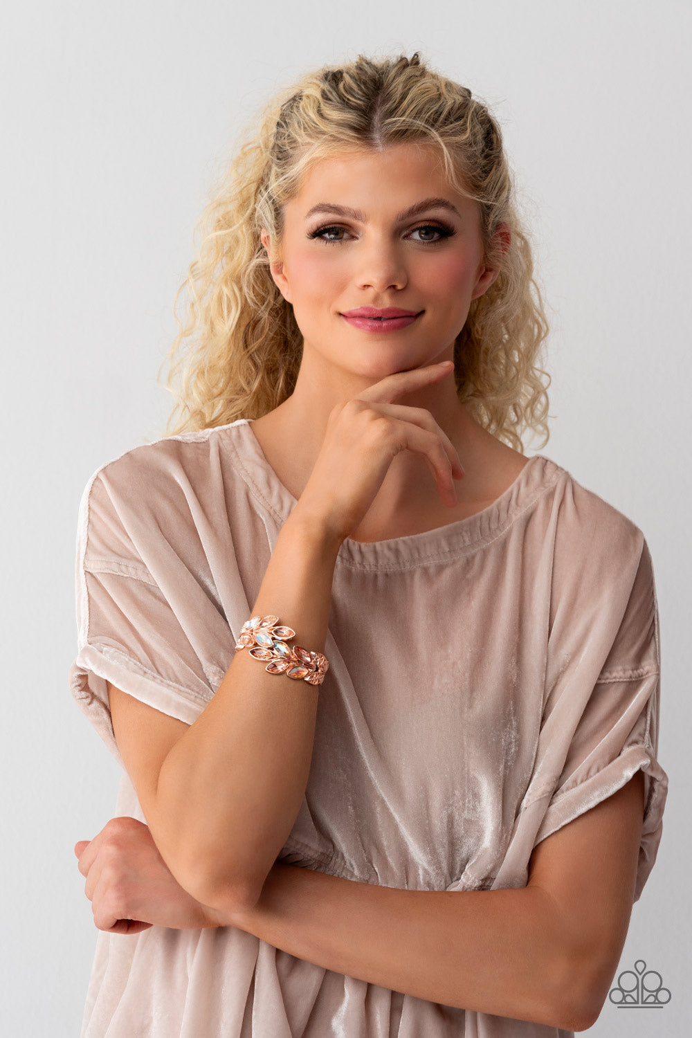 Paparazzi Accessories Luminous Laurels - Rose Gold Rose gold and peachy iridescent marquise-cut gems blossom from an array of rose gold marquise frames embossed in leafy filigree and tactile studs. Each frame interlocks around the wrist in a whimsical pat
