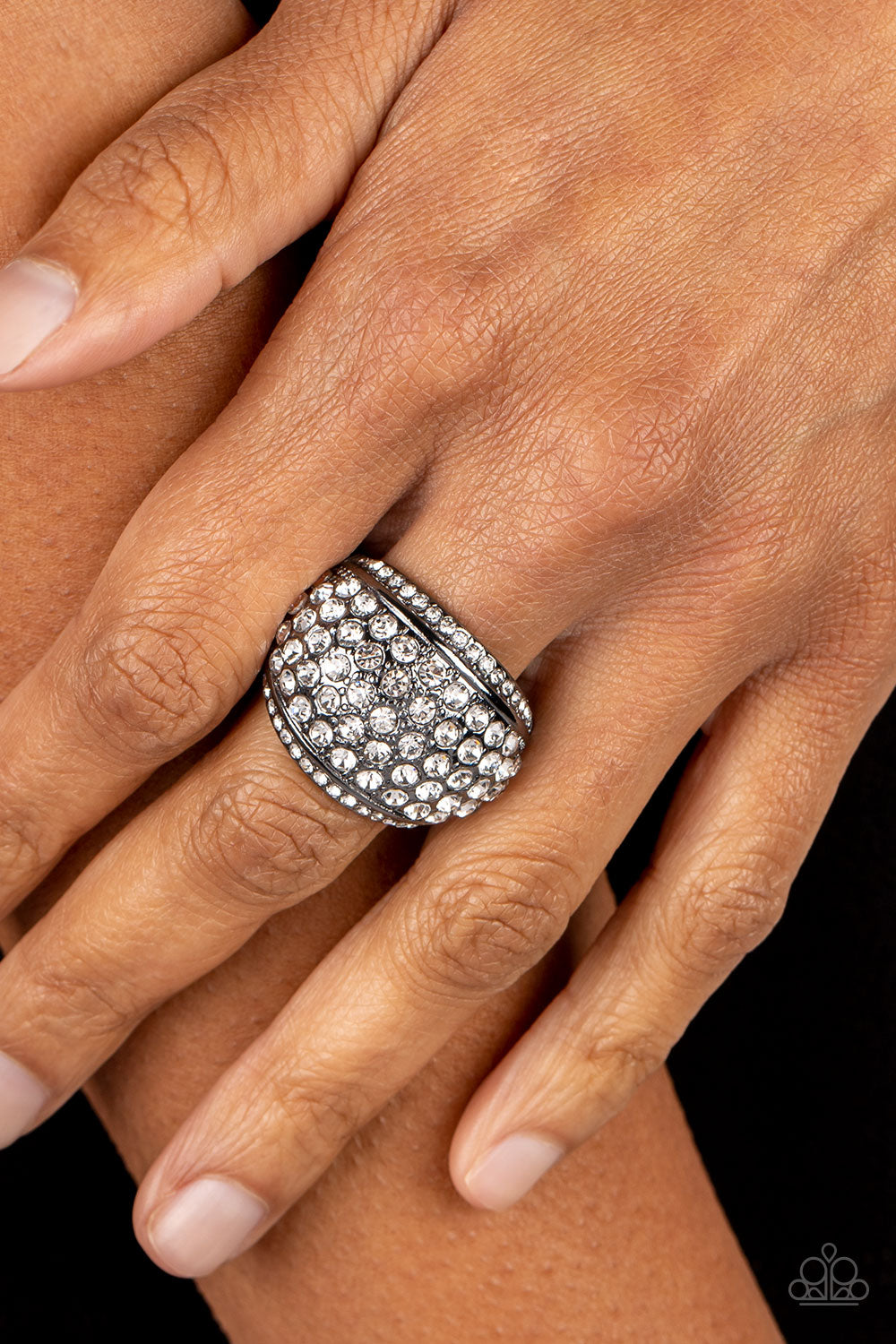 Paparazzi Accessories Running OFF SPARKLE - Black A thick band of gunmetal arcs across the top of the finger, creating an exaggerated rounded frame. Countless tiny white rhinestones scatter across the surface, as straight lines of even more rhinestones li