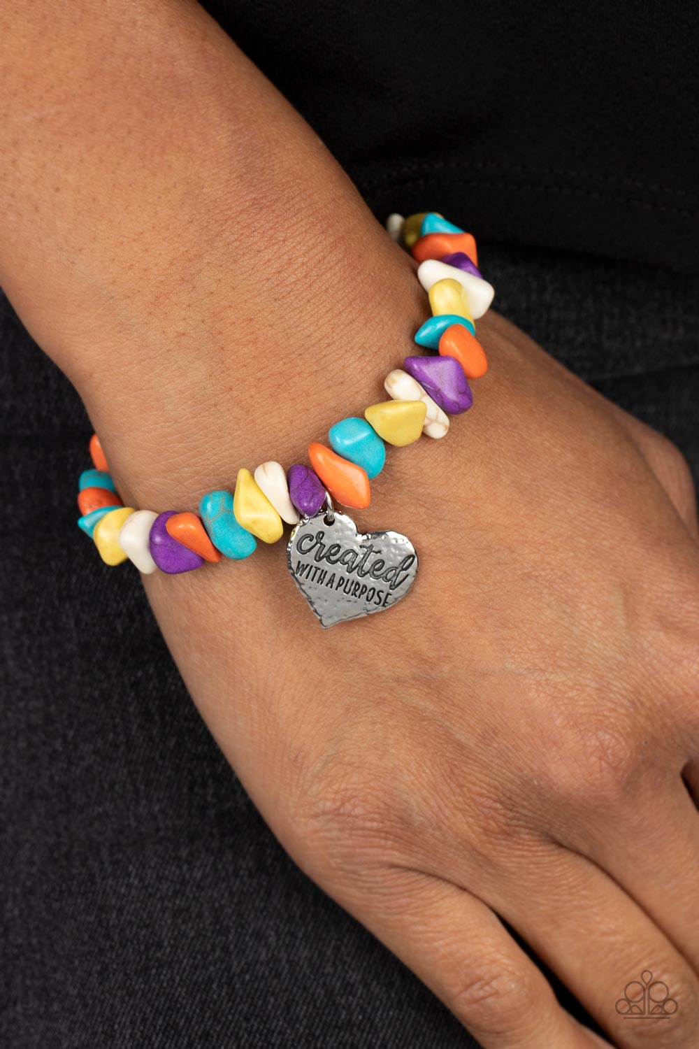 Paparazzi Accessories Stony-Hearted - Multi An assortment of chiseled orange, turquoise, yellow, purple, and white stones are threaded along an elastic stretchy band in a free-spirited pattern. A silver heart charm, hammered in antiqued texture is engrave