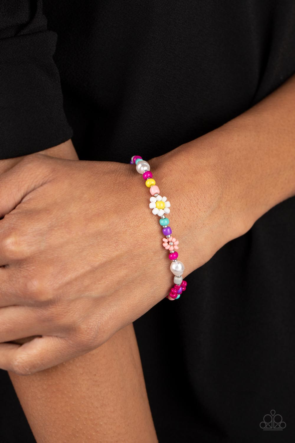 Paparazzi Accessories Groovy Gerberas - Pink Modeled after gerber daisies, multicolored seed beed petals in shades of hot pink, orange, pink, and white bloom around lemon yellow, purple, and silver beaded centers resulting in a dazzling collection of flor