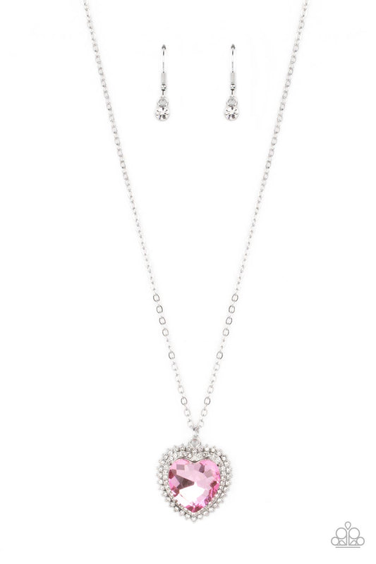 Paparazzi Accessories Sweethearts Stroll - Pink A pink crystal-like heart gem sparkles dramatically as it's wrapped in a glassy white rhinestone-studded heart frame. Adding additional shimmer, a second layer of white rhinestones encircles the studded pend