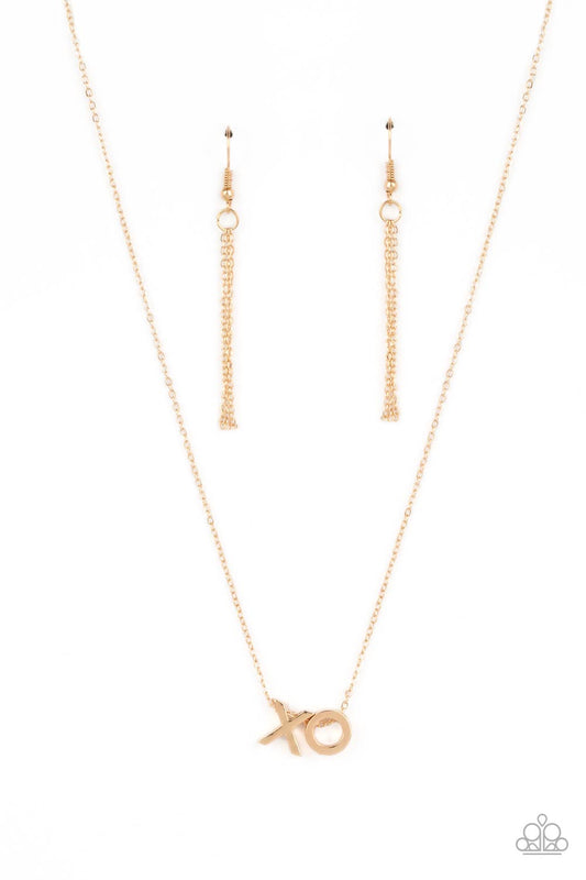 Paparazzi Accessories Hugs and Kisses - Gold A gold letter "X" and a letter "O" in the same metallic sheen, slide along a classic gold chain, creating a dainty, fun-loving design. Features an adjustable clasp closure. Sold as one individual necklace. Incl