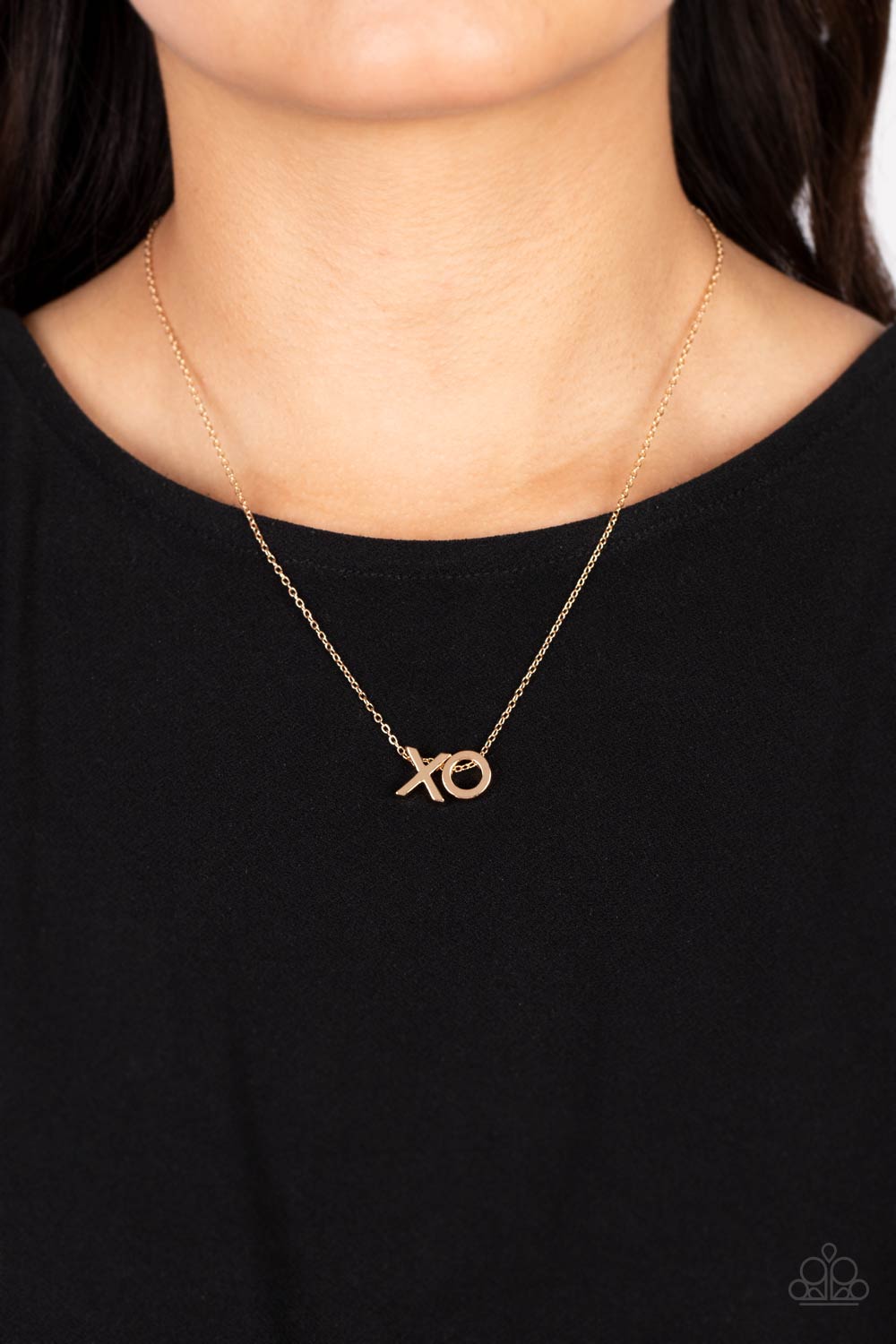 Paparazzi Accessories Hugs and Kisses - Gold A gold letter "X" and a letter "O" in the same metallic sheen, slide along a classic gold chain, creating a dainty, fun-loving design. Features an adjustable clasp closure. Sold as one individual necklace. Incl