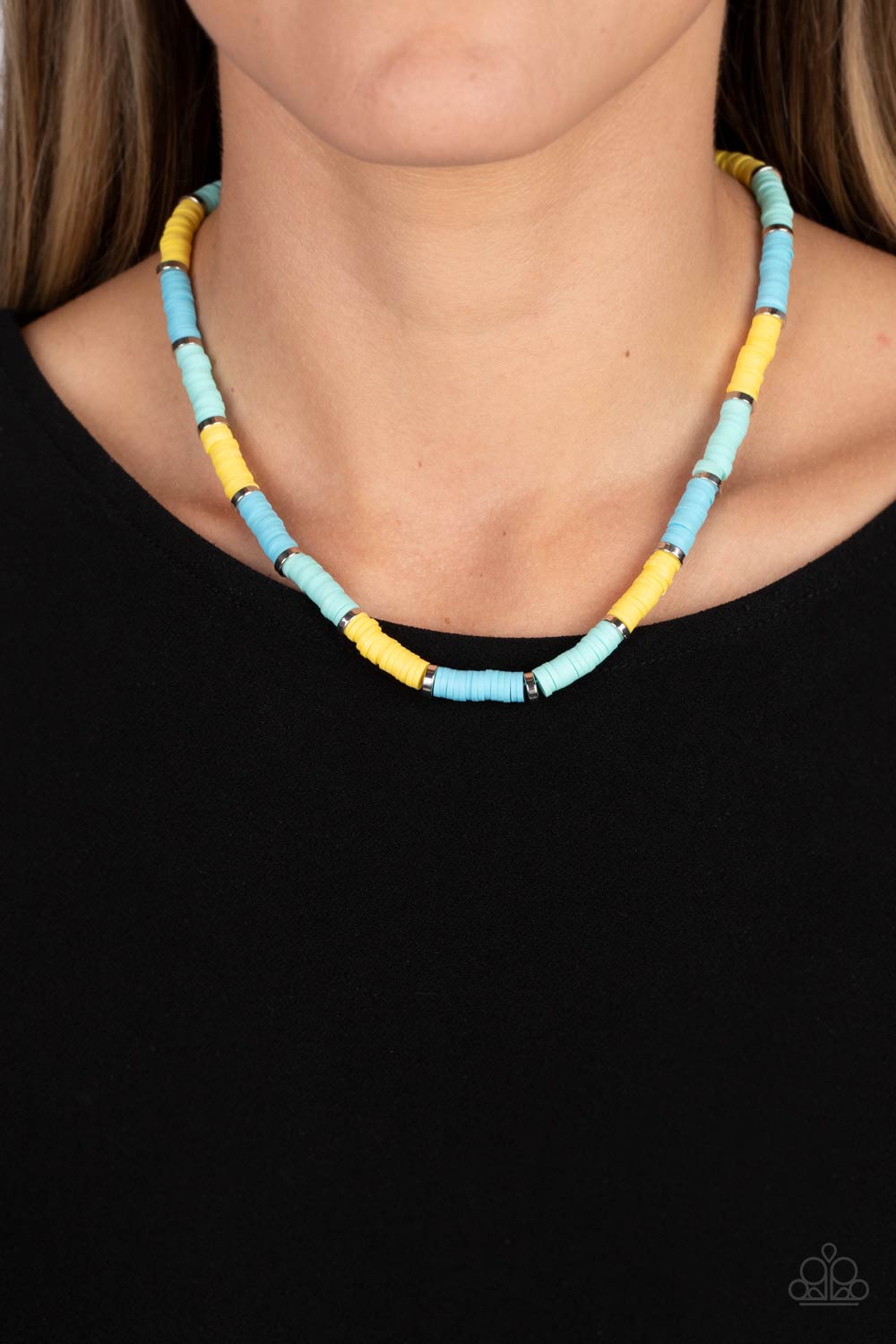 Paparazzi Accessories Rainbow Road - Blue Rubber discs in shades of Waterspout, Primrose, and turquoise are threaded along an invisible wire, adorning the collar in a courageous pop of color. Shiny silver discs separate the bands of color, adding a hint o