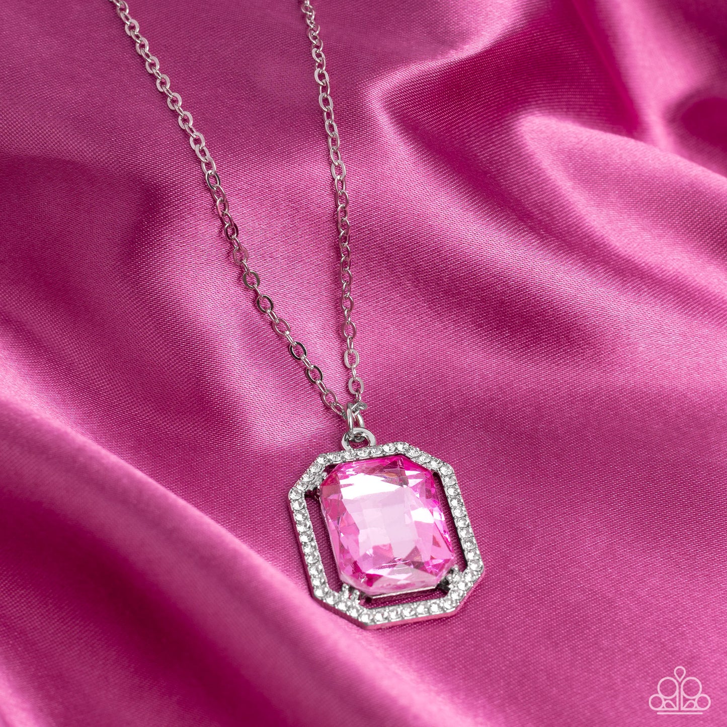 Paparazzi Accessories Galloping Gala - Pink A dramatically oversized, emerald-cut pink gem shimmers as it swings from the bottom of a long silver chain. Dainty white rhinestones create an airy frame that wrap around the reflective centerpiece, scattering